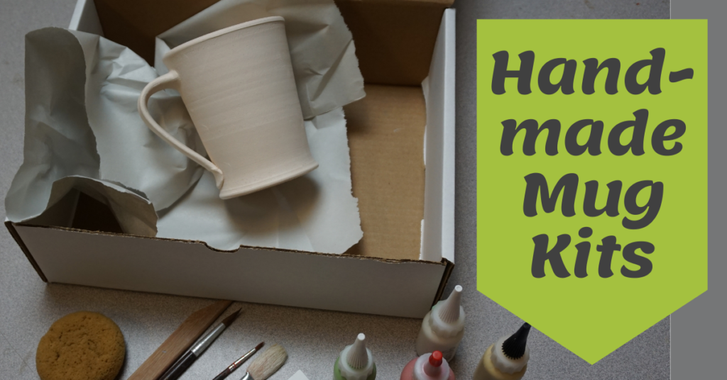 A view of the Handmade Mug Kit with a bisque-fired mug ready to decorate, bottles of glaze, brushes and tools.